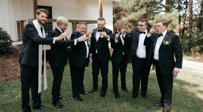 Groom with groomsmen taking shots